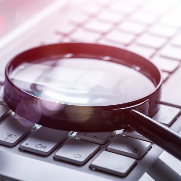 advanced system repair system optimizers magnifying glass on keyboard